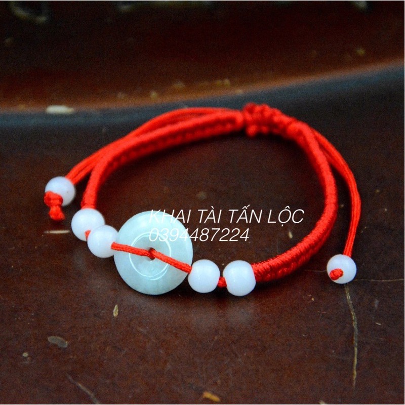 Vòng tay đồng điếu dây đỏ bằng đá chiêu tài