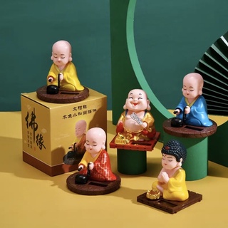 Di lặc tay quạt gật đầu - Chú tiểu gõ mõ gật đầu
