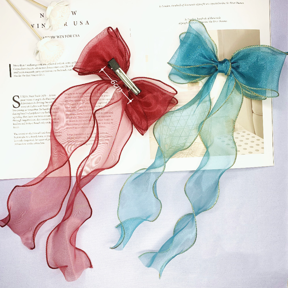 Kẹp tóc đính nơ đáng yêu dành cho nữ