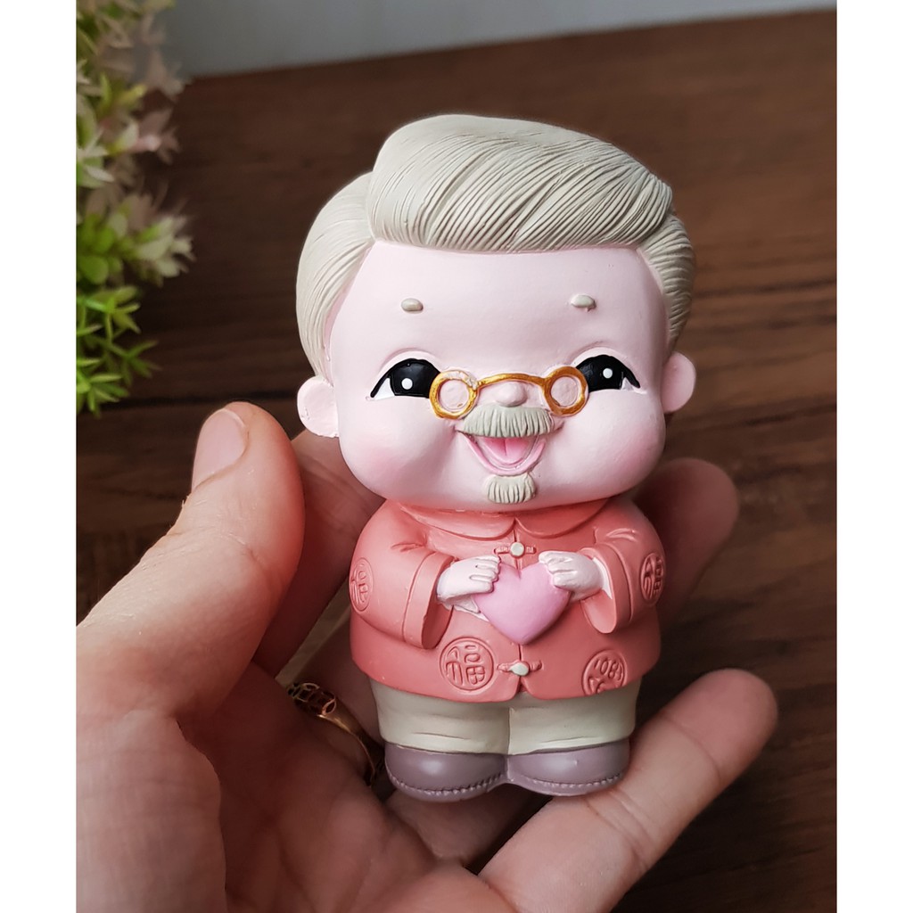 Bộ 02 tượng Ông Bà chibi kèm túi chữ Phát và chân đế tam cấp vuông nhỏ