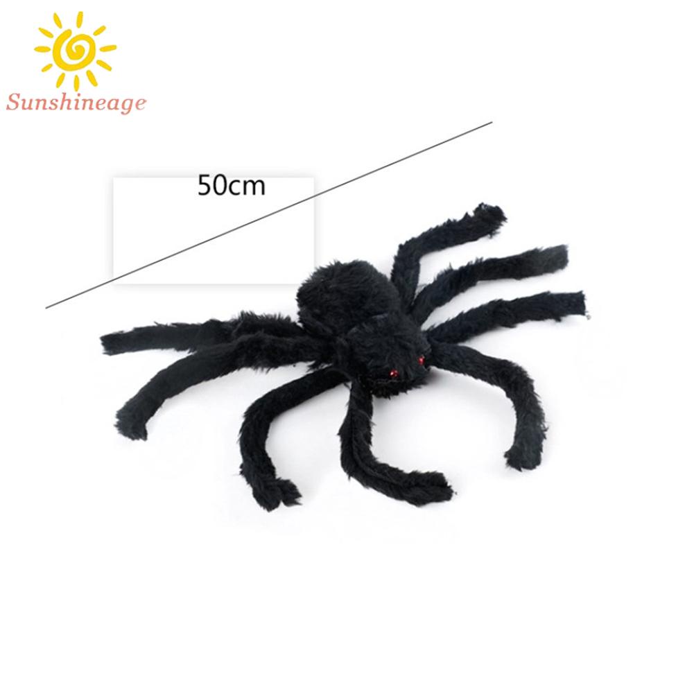 Halloween giant spiders hang in haunted homes, decorated with black fake spiders, cunning toys and Halloween gifts