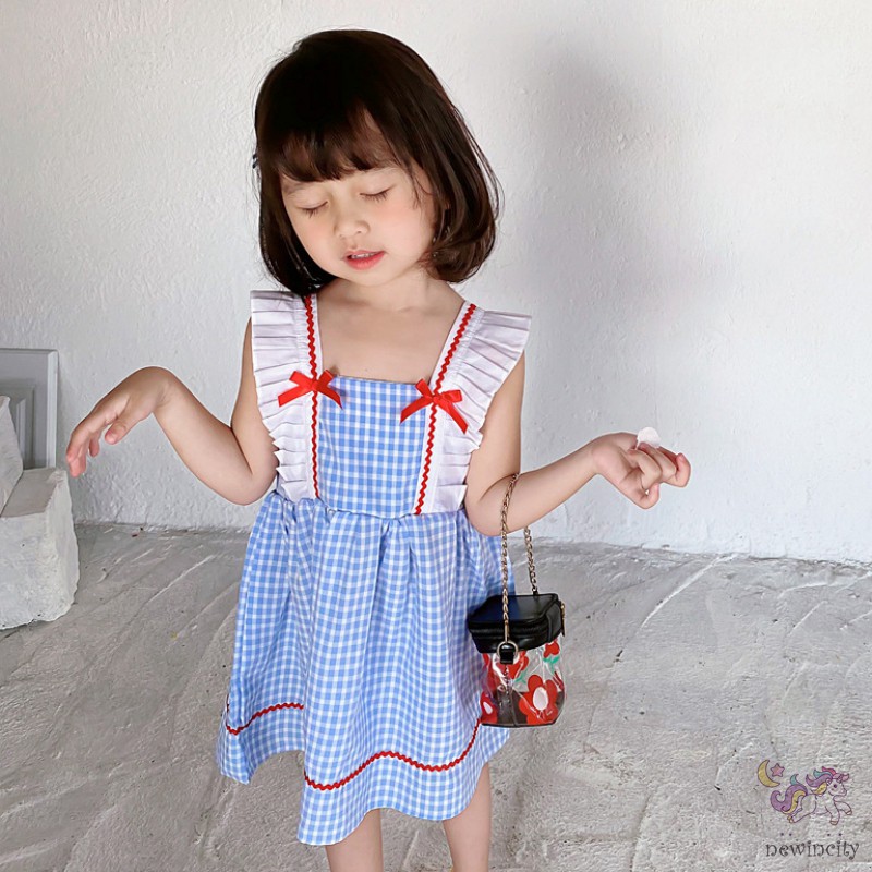 Đầm Sọc Caro Thắt Nơ Cho Bé Gái