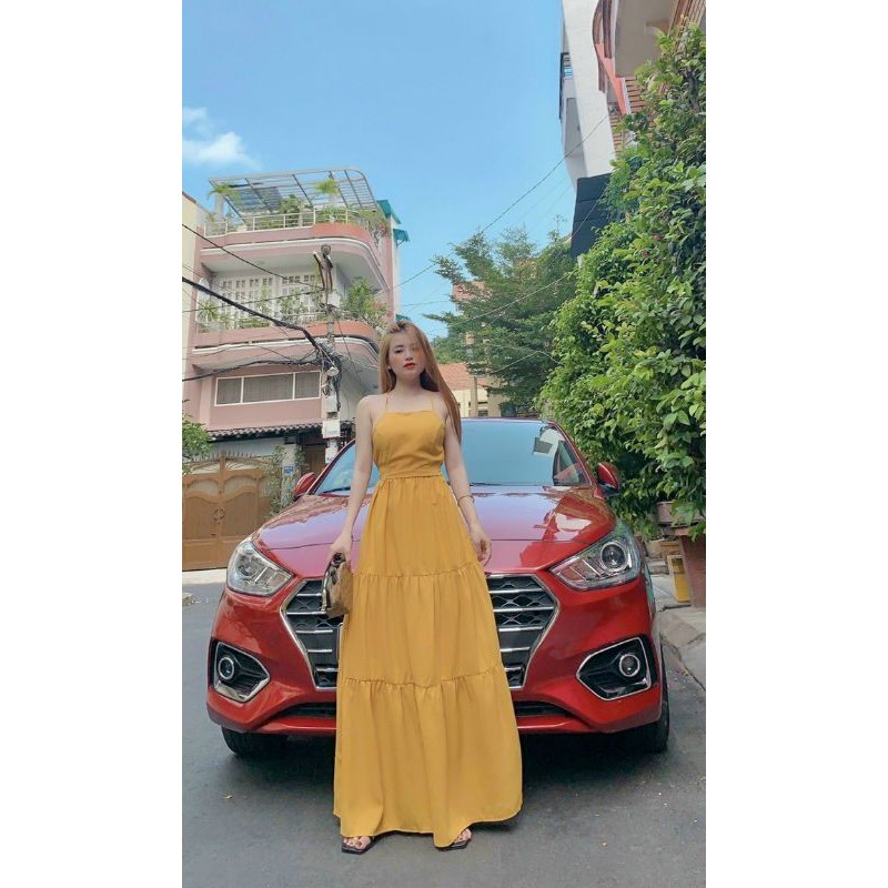 Đầm maxi vàng đan lưng sau