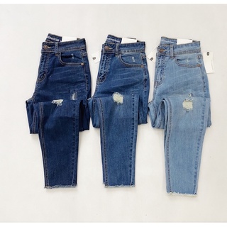 Quần jeans thiêu rách
