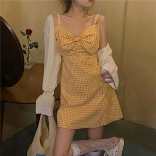 Váy 2 dây caro vàng nơ ngực