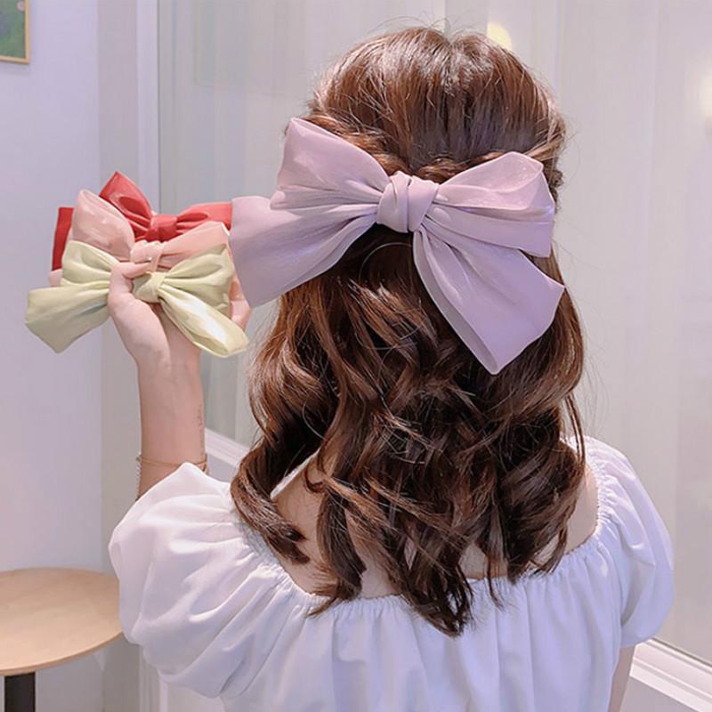 Kẹp tóc đính nơ màu trơn phong cách Hàn Quốc nữ tính xinh xắn