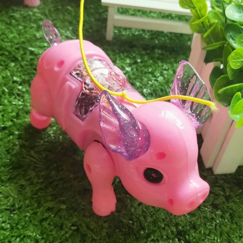 Đồ chơi heo đi bộ có đèn và phát nhạc cho bé