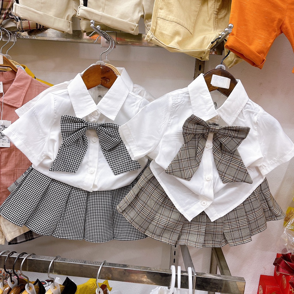 Set váy học sinh bé gái, áo sơ mi trắng đính nơ kèm chân váy kẻ xếp ly