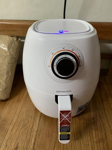 An aerial view of waves crashing against a shore.