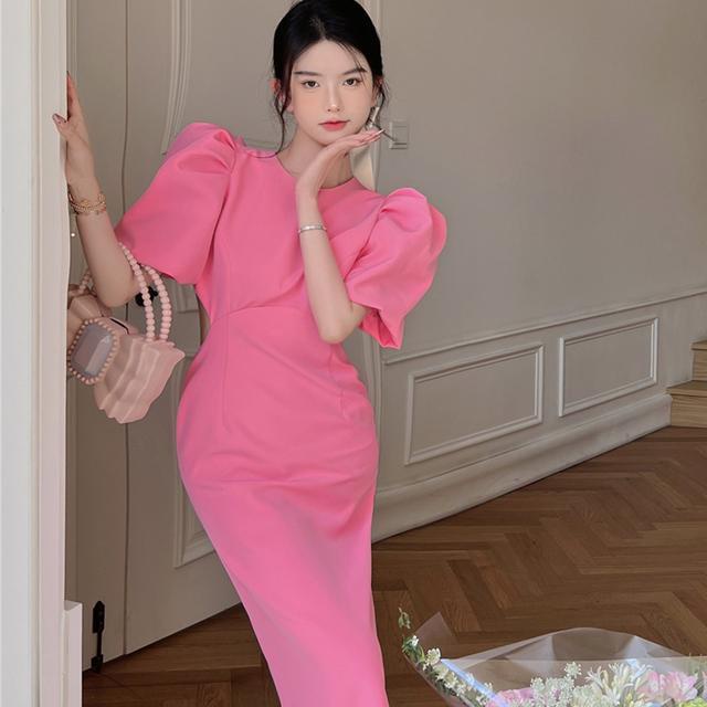 Đầm màu hồng nơ ngắn tay phồng hở lưng khoét giữa cho nữ UBU6