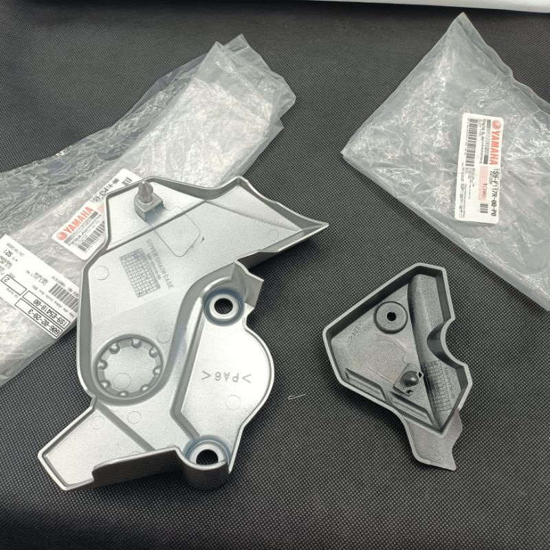 Cặp ốp nhựa che nhông mang cá, giò đạp xe EXCITER 2005-2010 bạc zin