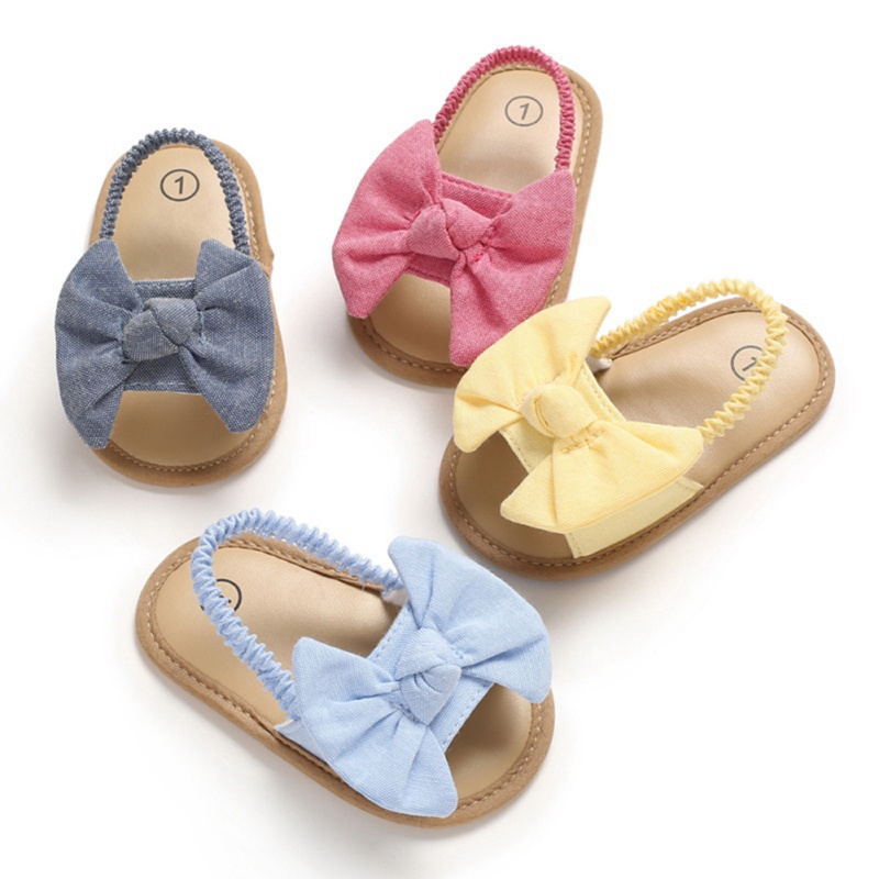 Giày sandal tập đi đính nơ chất liệu vải chống trượt xinh xắn thời trang mùa hè dành cho bé gái sơ sinh
