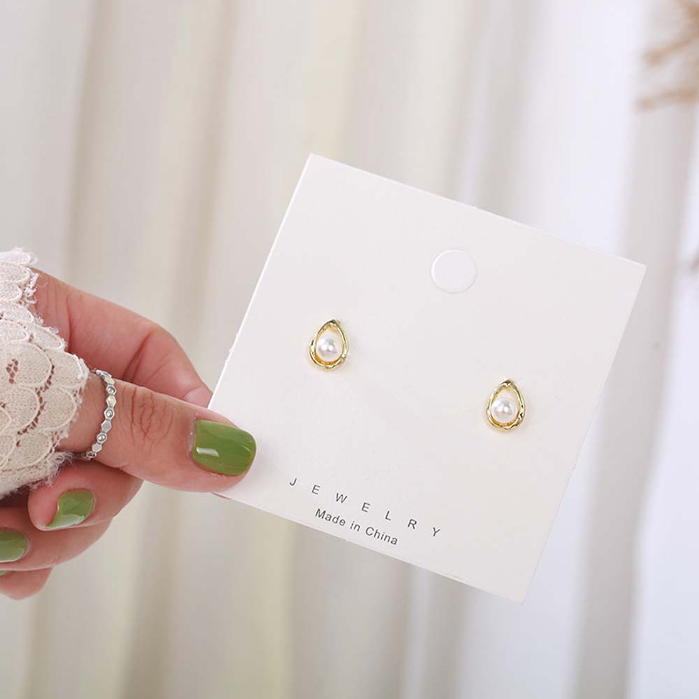 Khuyên tai nữ trang đính ngọc trai tạo hình độc đáo sang trọng