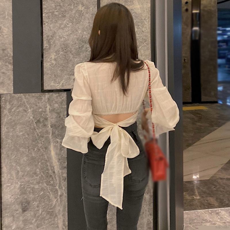 Áo sơ mi tay dài phối nơ hở lưng phong cách Hàn Quốc cho nữ