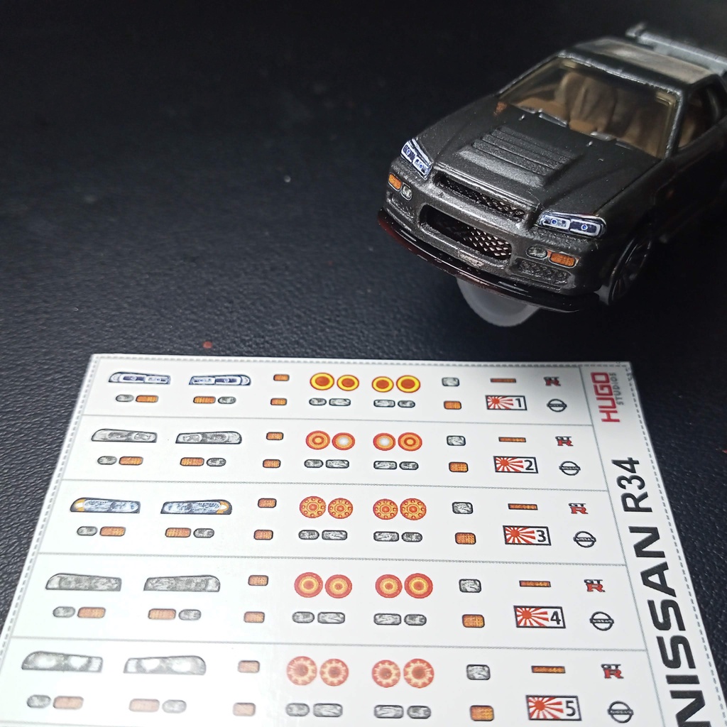 Hugo Studios Decal trượt nước đèn xe Nissan R34 tỉ lệ 1/64 chưa phủ clear