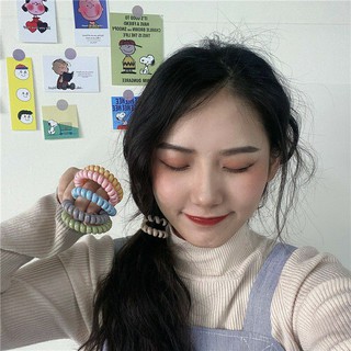 Cột tóc lò xo màu pastel