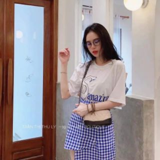 Set pull trắng + chân váy caro xanh đắp lệch tà