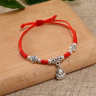 vòng tay dây rút chỉ đỏ