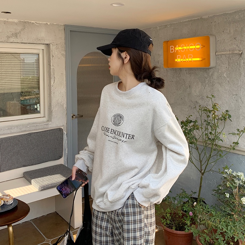 Áo thun tay dài dáng rộng in chữ phong cách Hàn Quốc thời trang cho nữ