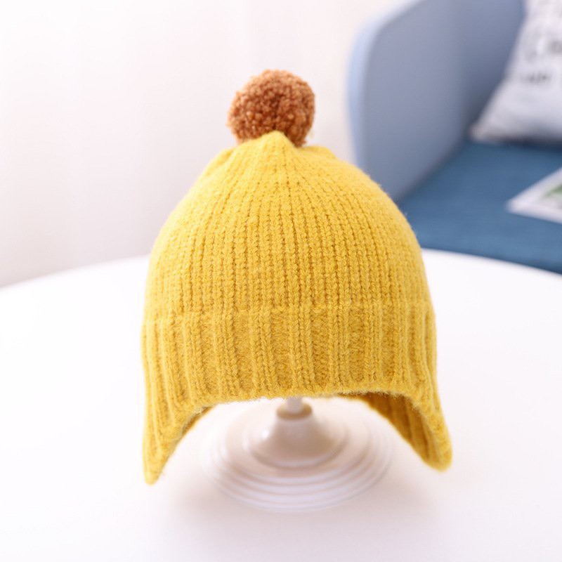 Nón len cục bông giữ ấm cho bé