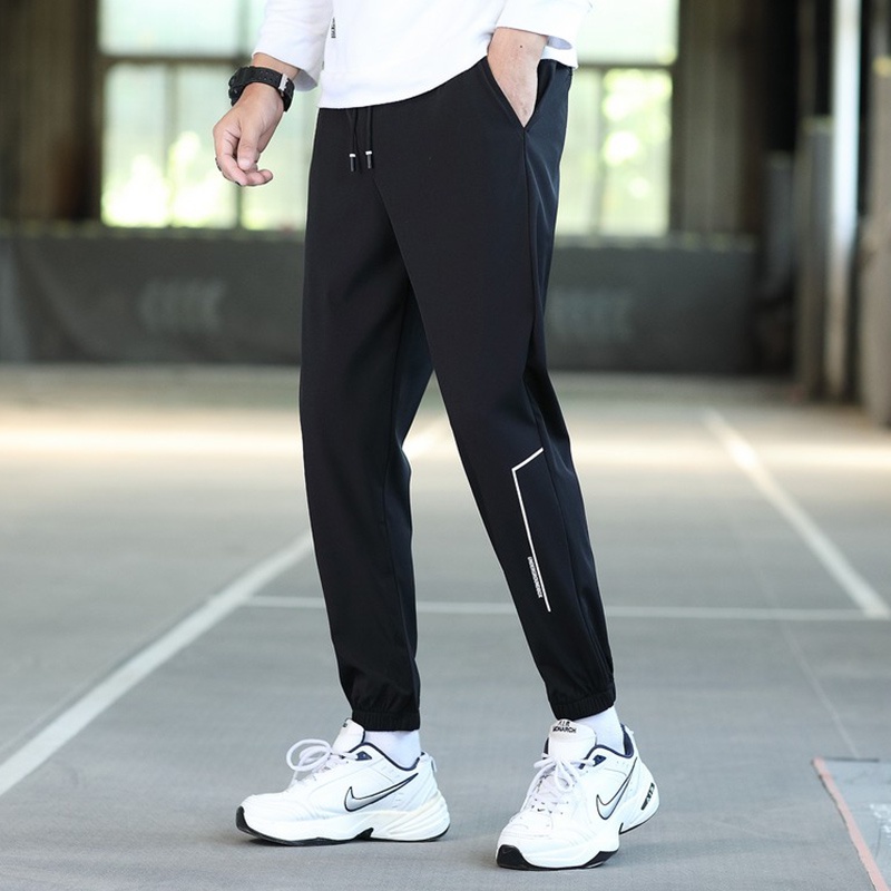 Quần jogger thể thao màu trơn chất gió dù mềm mịn in họa tiết phong cách Hàn Quốc cho nam quần gió nam