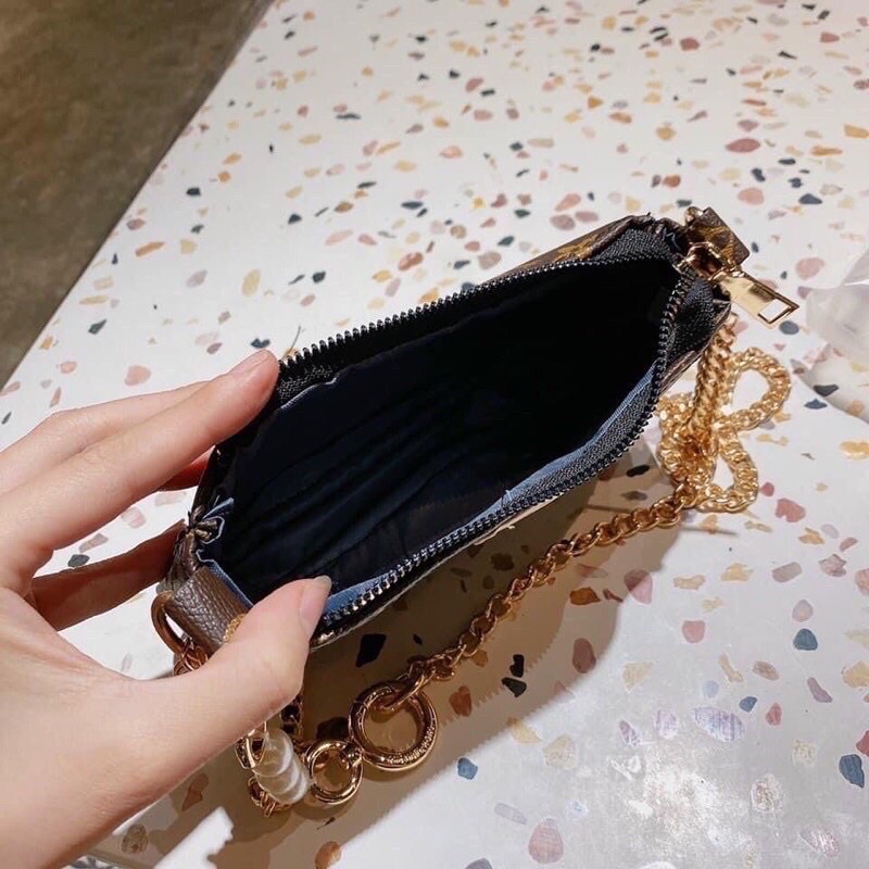 Túi kẹp nách LV dây phối ngọc