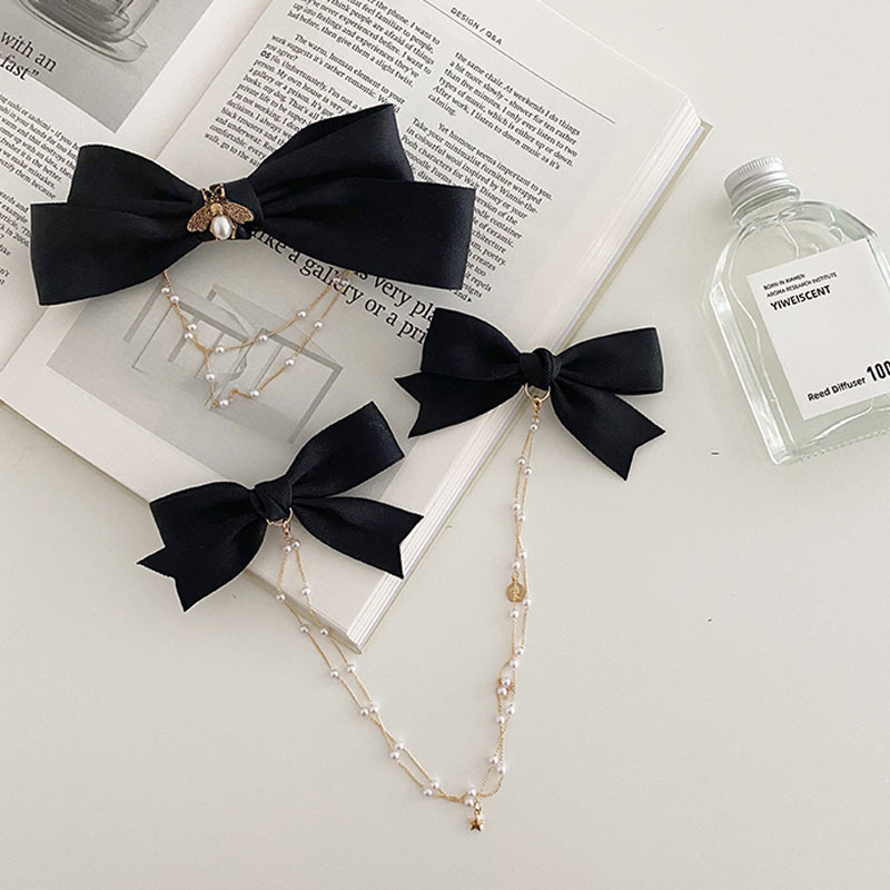 Kẹp tóc hình nơ đính ngọc trai nữ tính thời trang