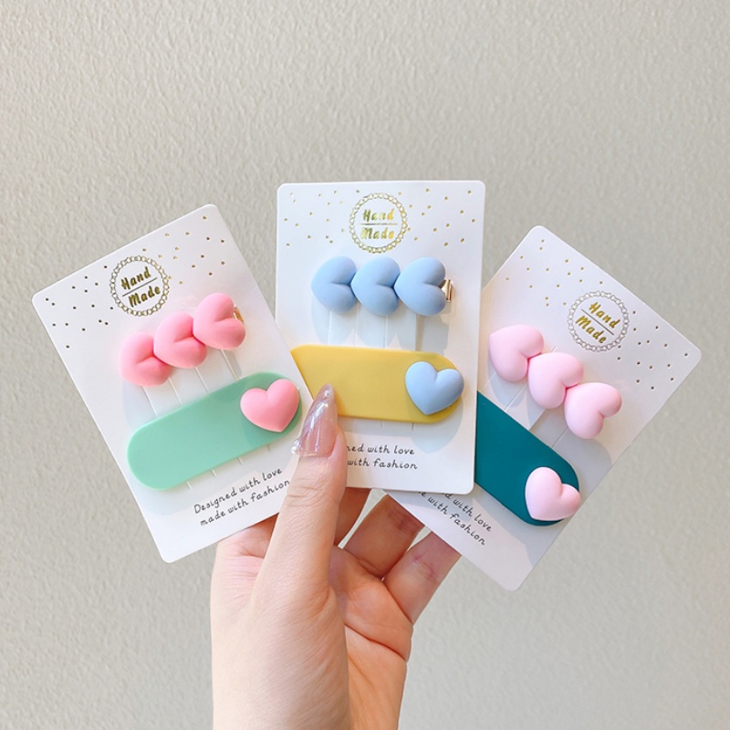 Kẹp tóc nhựa hình trái tim màu sắc đơn giản cho bé