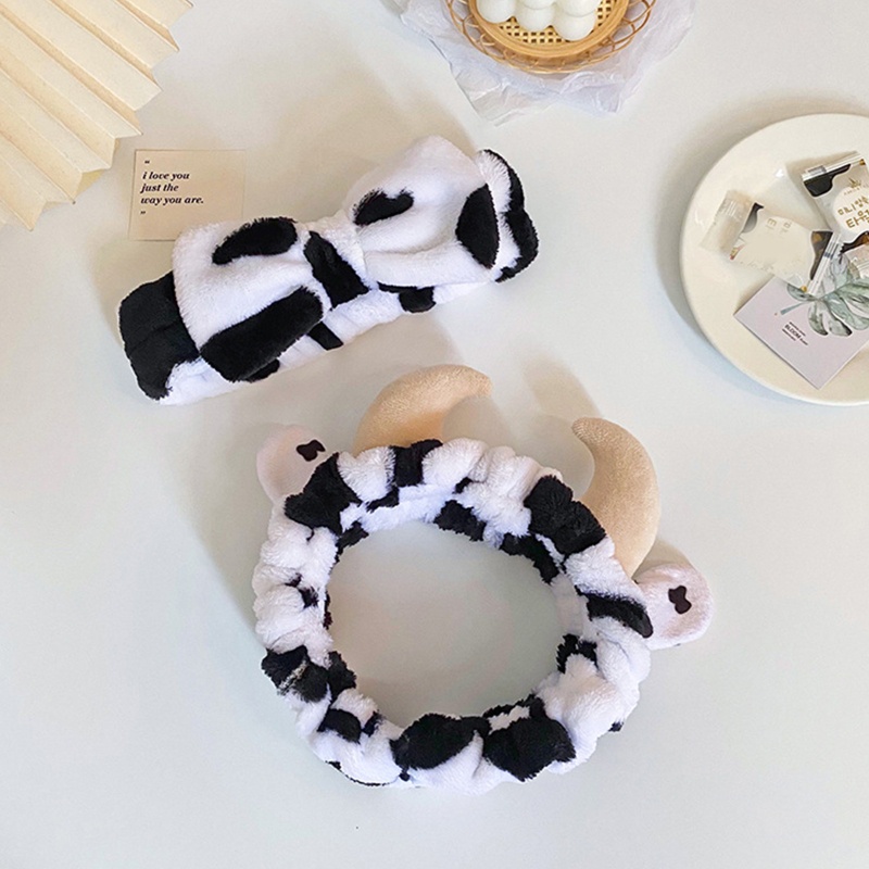 Băng Đô Cài Tóc Bằng Vải Flannel Mềm Họa Tiết Bò Sữa Đính Nơ Dễ Thương Cho Nữ