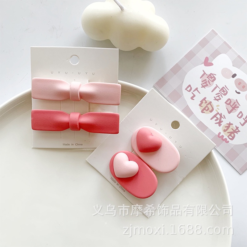 Kẹp tóc nơ trái tim hồng thời trang phong cách Hàn Quốc cho bé