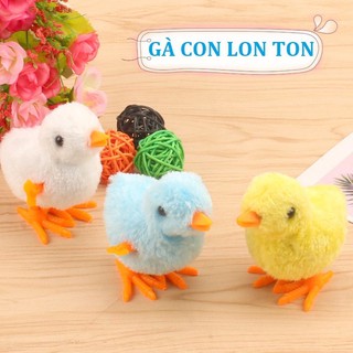 Đồ chơi gà lon ton dây cót trên thân con gà