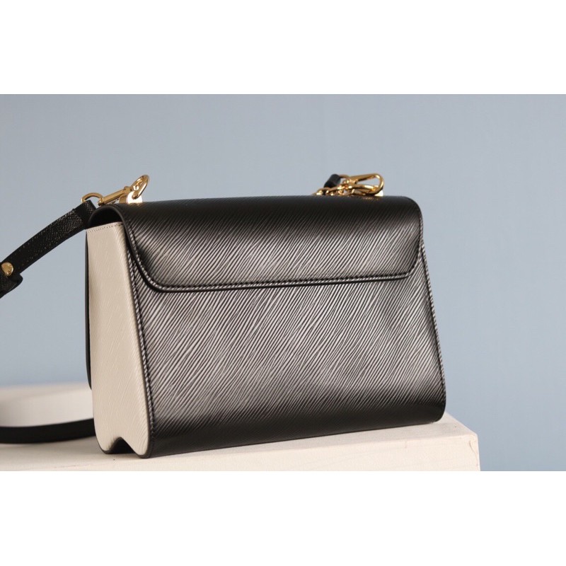 Túi xách tay nữ phom cứng có dây đeo khoá logo chữ một ngăn to louis vuitton Lv