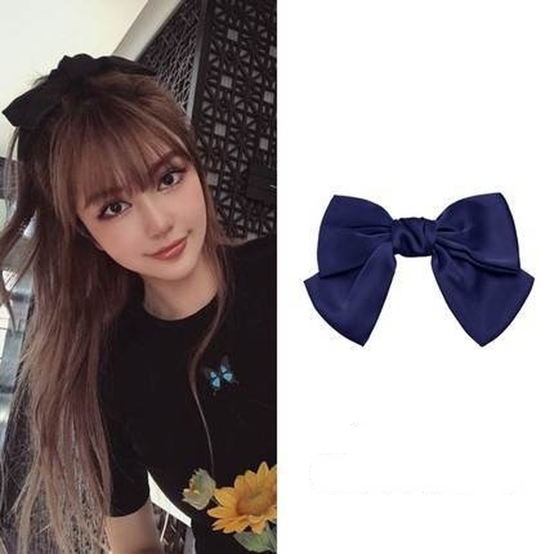 Kẹp tóc đính nơ đỏ thời trang mùa xuân xinh xắn