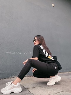 Quần legging in hoa cúc vàng
