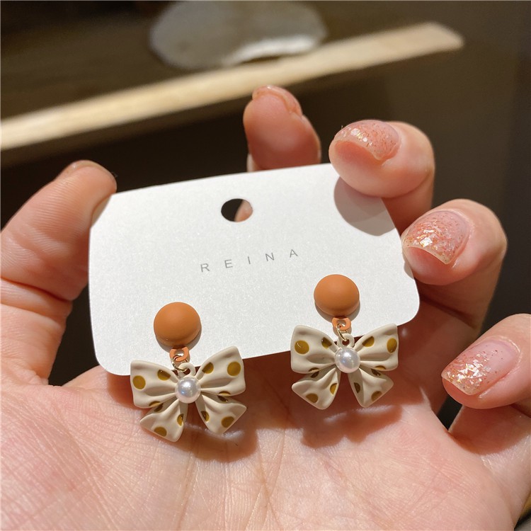 Bông tai hình nơ chấm bi cam thời trang nữ/ Khuyên tai phong cách Hàn Quốc