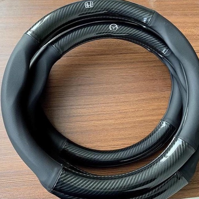 Bọc vô lăng CARBON phối da thoáng khí đủ các hãng xe Toyota-Honda-Hyundai-Mazda-KiA-Ford-Mitshubishi-Chevrolet cao cấp