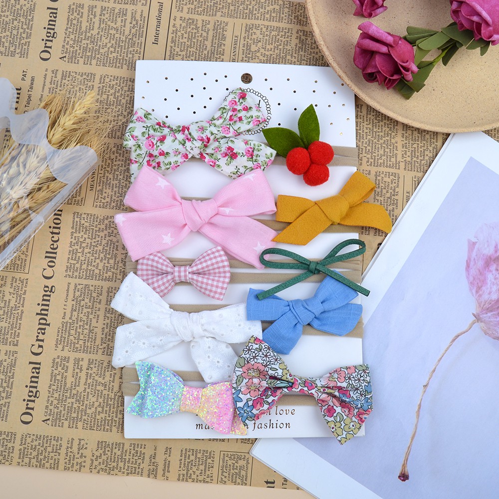 Băng đô KIDSBOWS đính nơ in hoa xinh xắn cho bé gái
