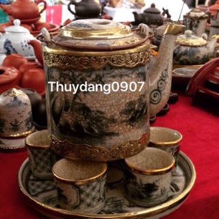 Bộ ấm tích men dạn bọc đồng hàng kĩ nghệ thuật tinh sảo nhé.