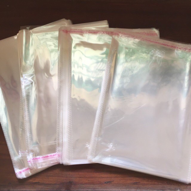 Nửa kg túi bọc ni lông OPP bóng kiếng dán miệng đựng quần áo, hàng hóa, đồ bộ, quần jean