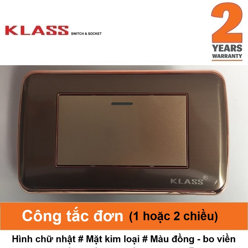 (Công tắc ổ cắm KLASS) Công tắc đơn hạt đại, hình chữ nhật, mặt kim loại màu vàng đồng, viền cách điệu KLASS 118KV1