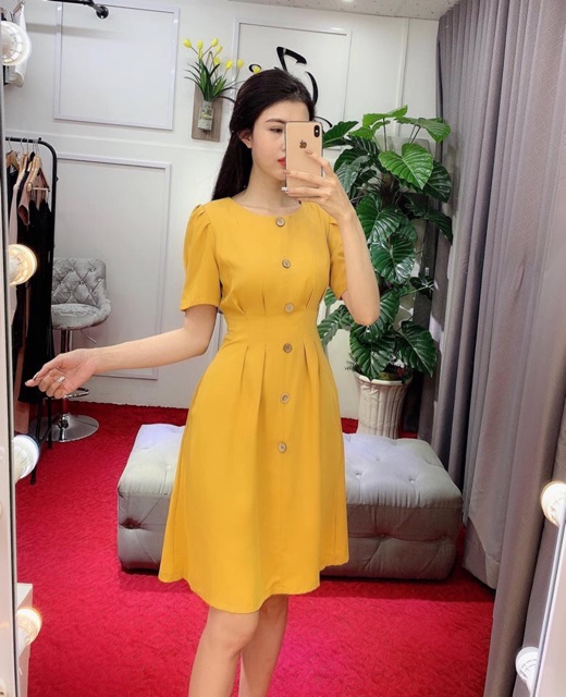 Đầm xoè trích eo nút gỗ