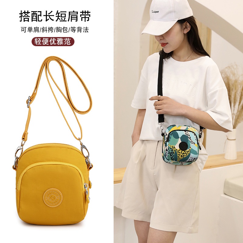 Túi đưa thư của phụ nữ mới Nhật Bản và Hàn Quốc... màu đặc trưng nhỏ màu vuông bao chống da tất màu... in vải có đôi vai thay đổi túi điện thoại di động.