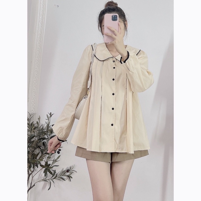 Áo sơmi dài tay cổ sen tròn có viền đen khuy đen