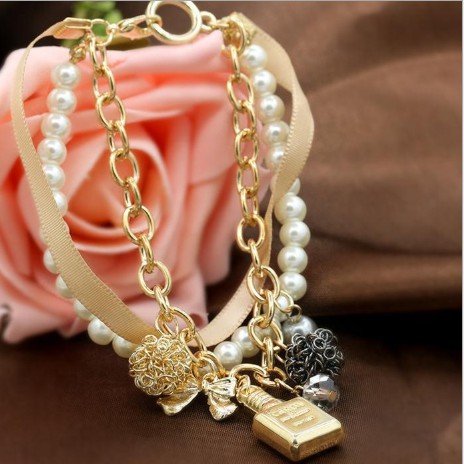 Vòng tay hạt châu nơ cung pha lê màu vang duyên dáng