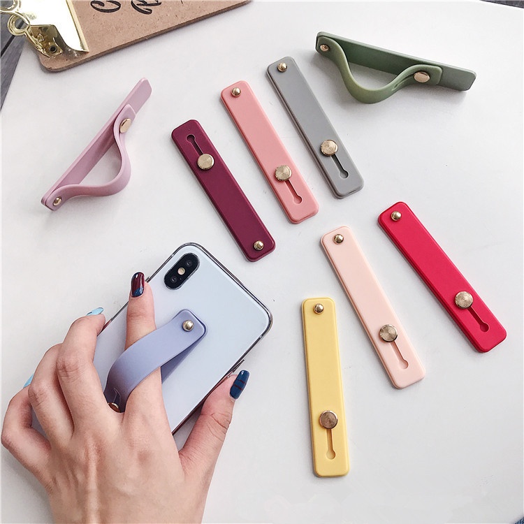 Di động Đa chức năng Đỡ Điện Thoại Bằng Silicon Đàn Hồi Màu Kẹo Ngọt Có Dây Đeo Cổ Tay Dán