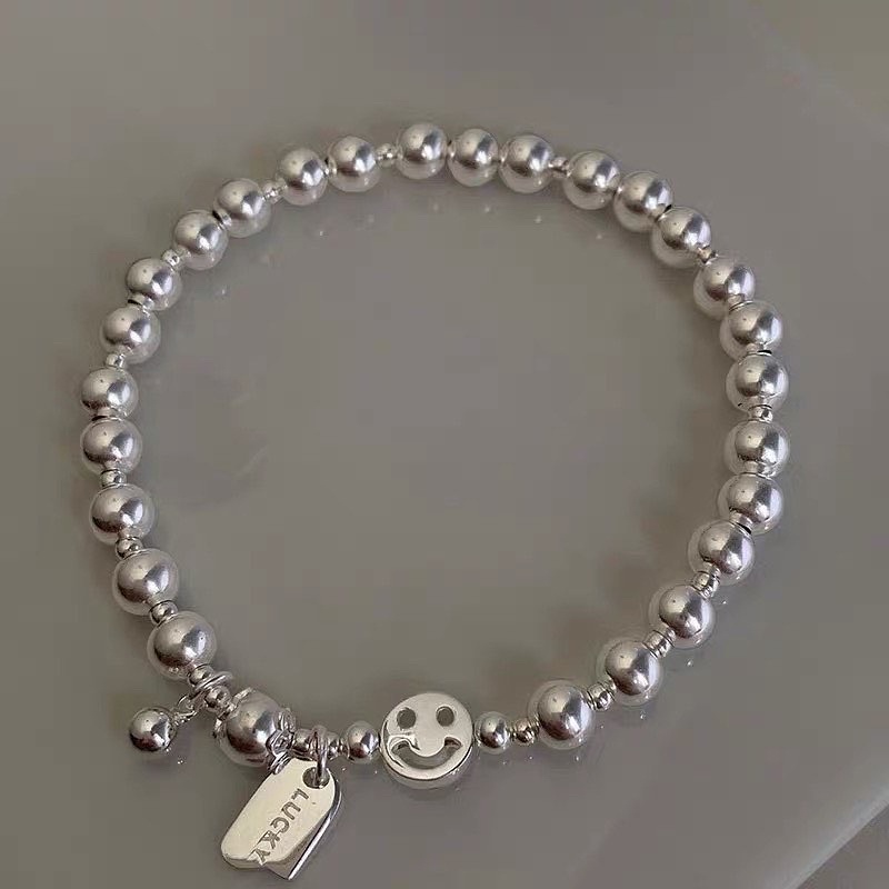 Vòng tay dây cước charm mạ bạc ngọc trai nhân tạo