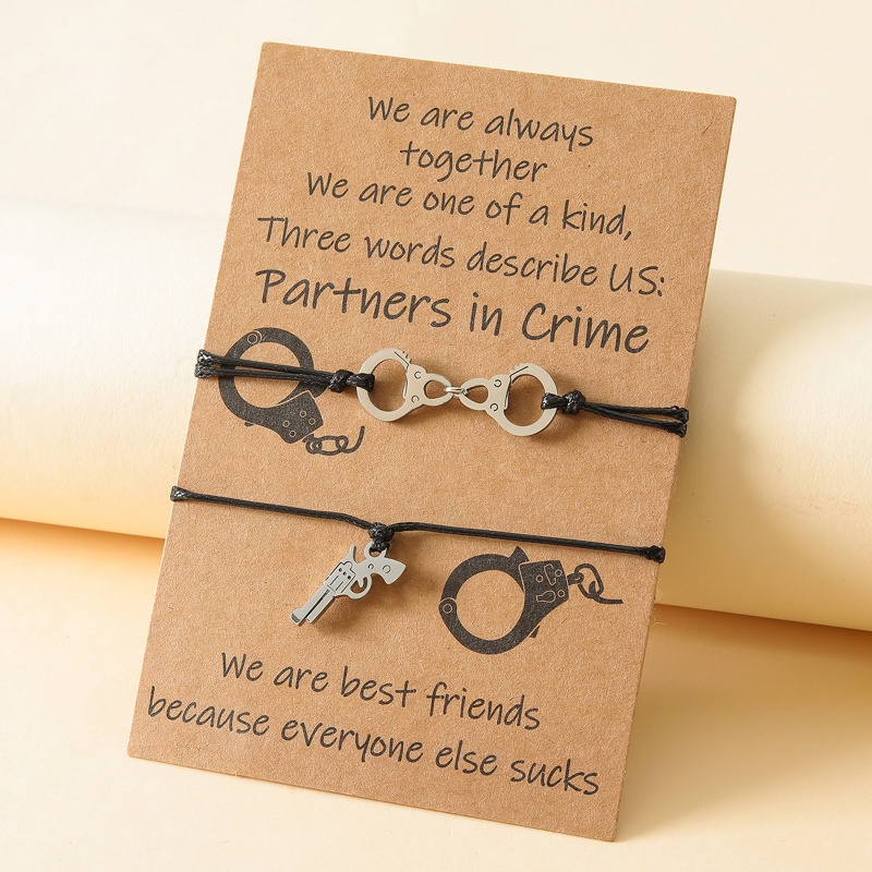 Vòng Cổ Choker Bằng Thép Không Gỉ Hình Còng Tay Và Súng Lục Độc Đáo