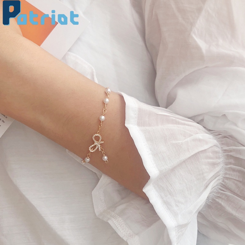 Vòng đeo tay chuỗi hạt ngọc trai giả mặt hình nơ thời trang cho nữ