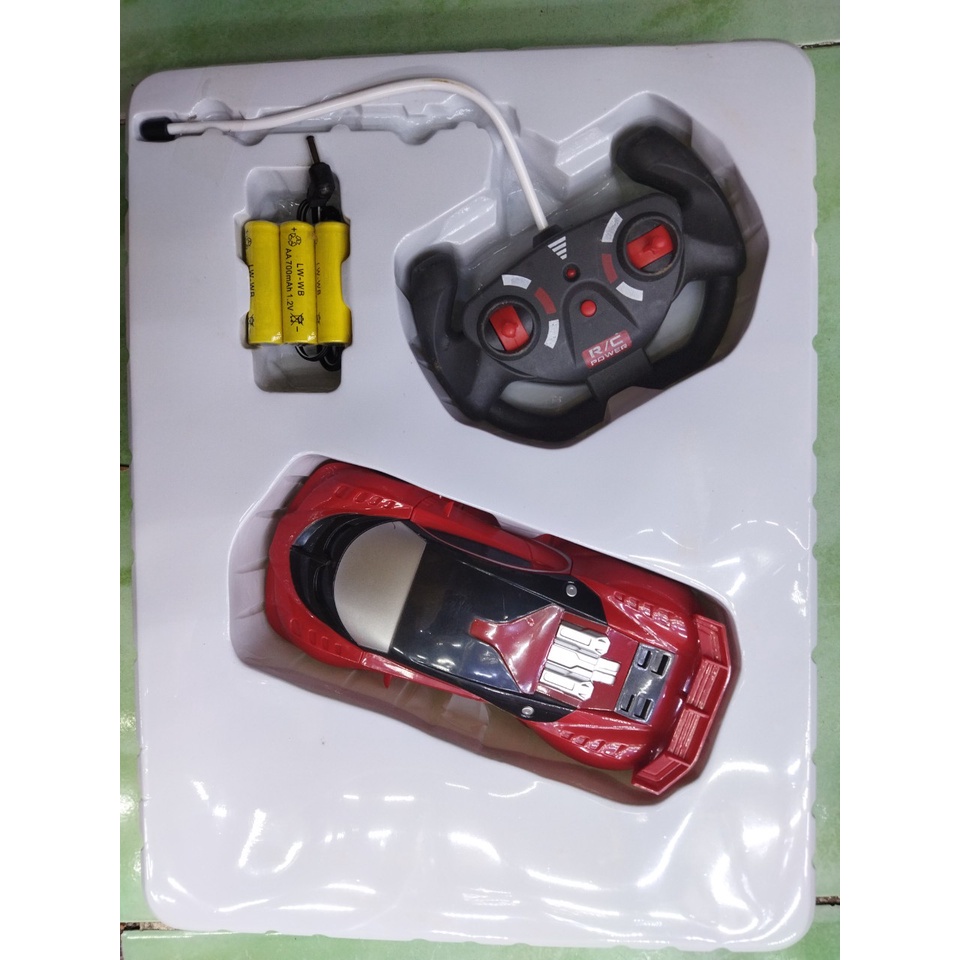 Xe điều khiển kiểu dáng xe đua, 2 màu xanh - đỏ, có thể tháo rời từng mảnh áo xe, ảnh chụp thật tại cửa hàng 3010