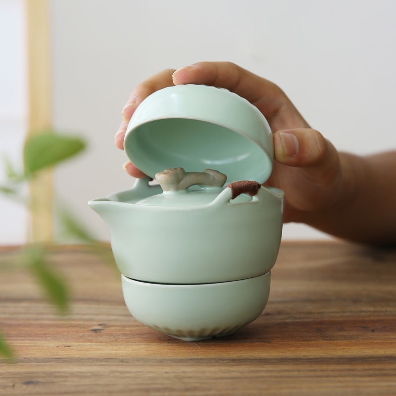 Du lịch bộ ấm trà bộ ấm trà bộ ấm trà di động Ru lò Ruyi nhanh khách hàng tách một người một ấm hai tách du lịch bộ trà kung fu